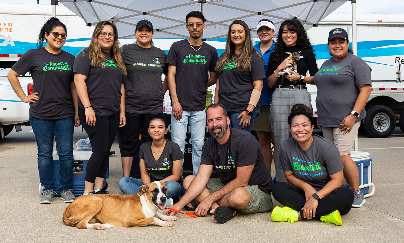 Community Resource Credit Union team taking a group photo at a community event.
