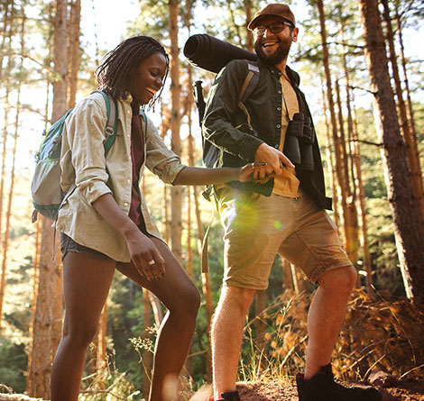 A couple hiking in the woods.